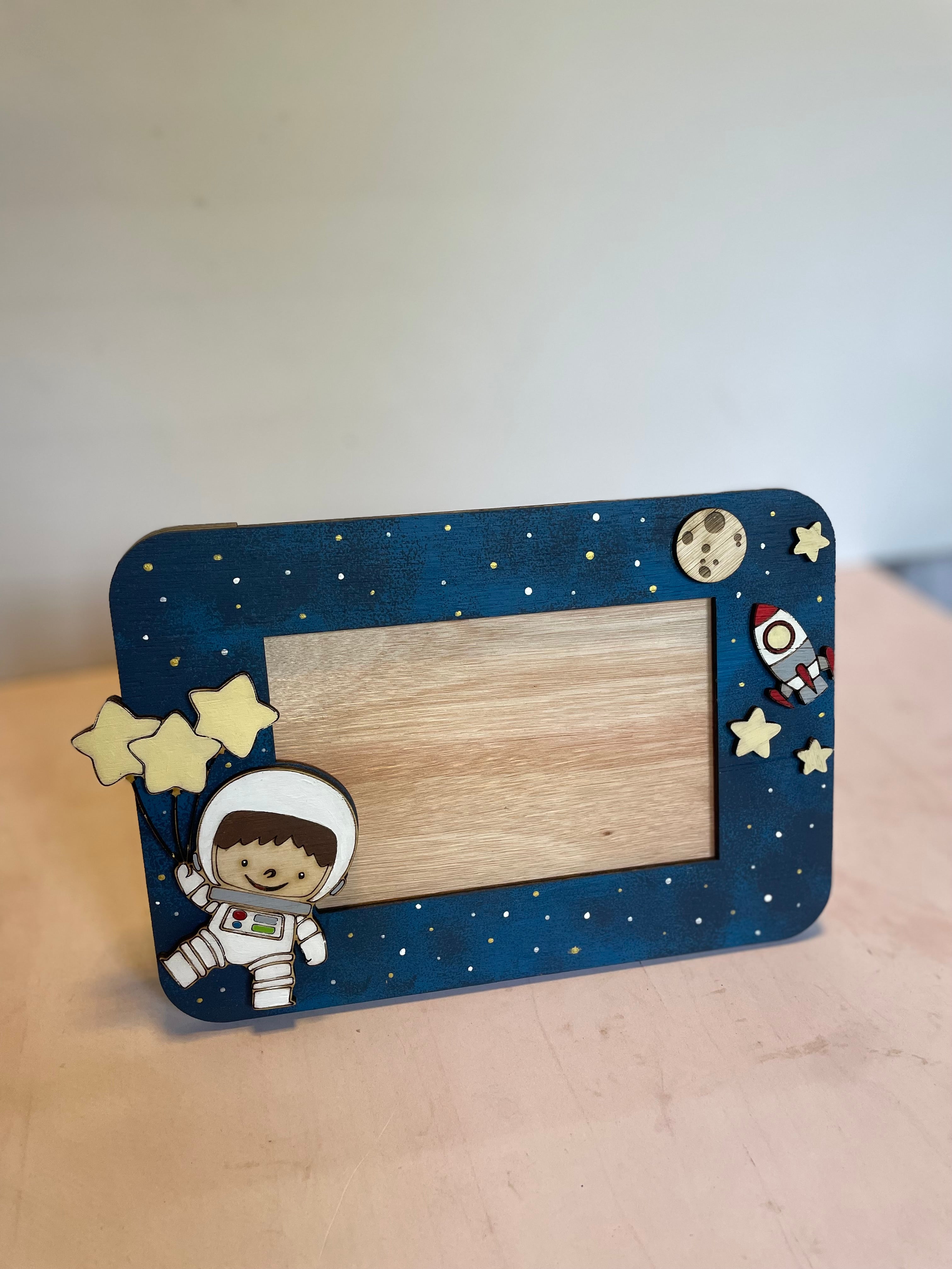 Porta retrato de astronauta
